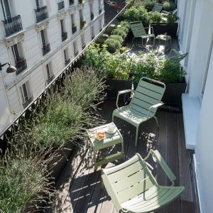A petite artisan hotel with balconies overlooking the Parisian rooftops - perfection!