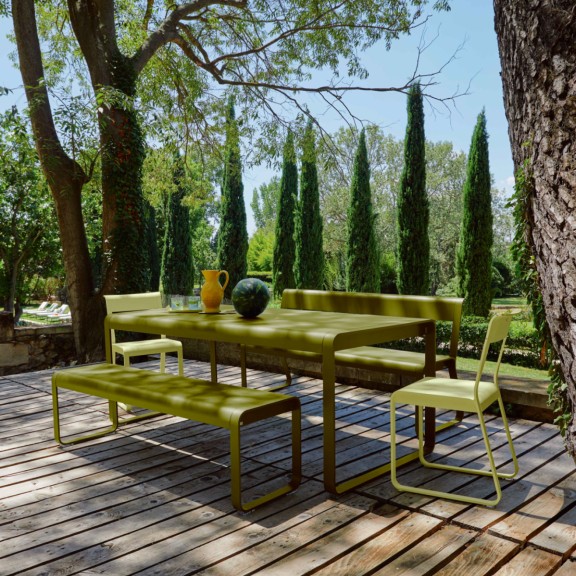 Outdoor dining table with benches on deck