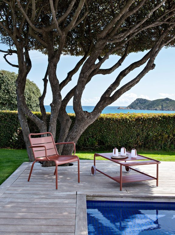 Fermob Luxembourg Lounge armchair and low trolley in Red Ochre