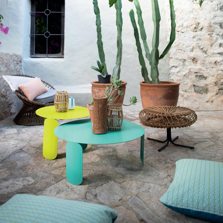 Fermob Bebop round low tables in Verbena and Lagoon Blue in front of terracotta pots
